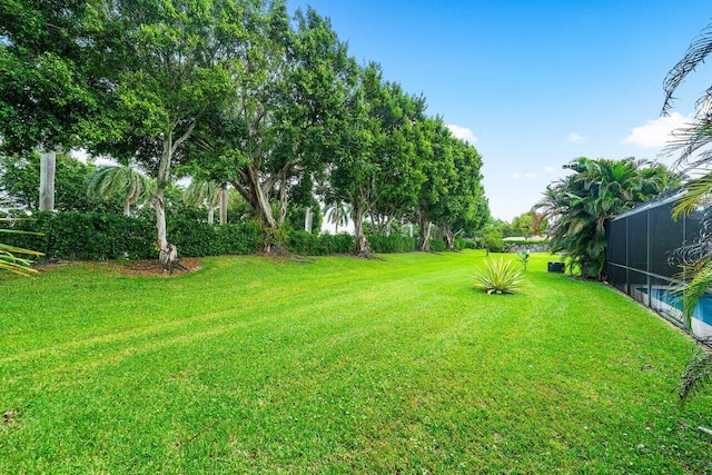 view of yard featuring a lanai