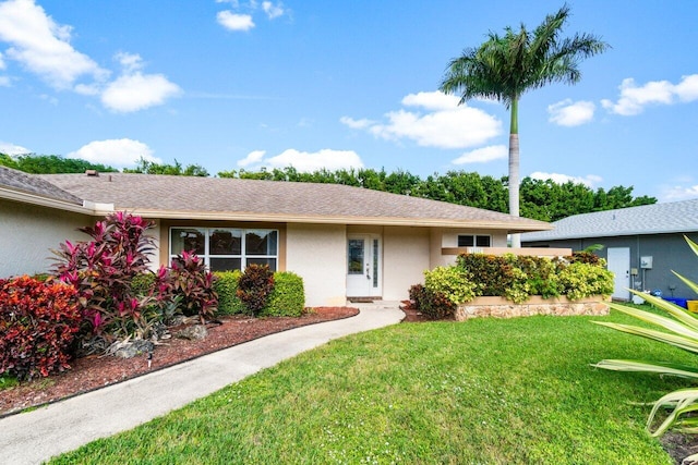 ranch-style home with a front yard