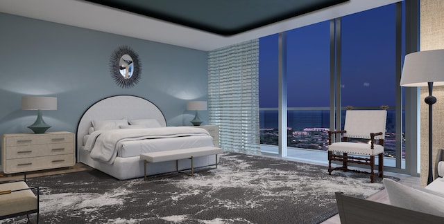 bedroom featuring floor to ceiling windows