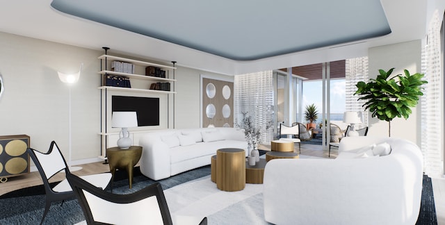 living room with hardwood / wood-style flooring and a tray ceiling