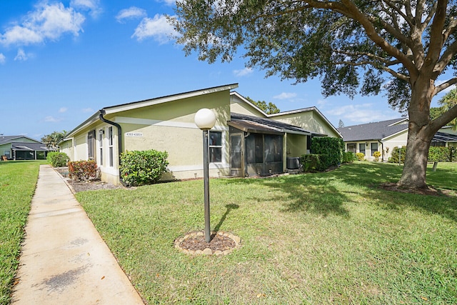 view of property exterior featuring a lawn and central air condition unit