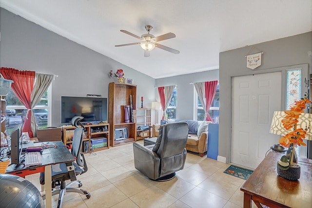 office featuring light tile patterned floors, ceiling fan, and lofted ceiling