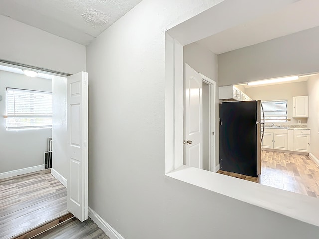 hall featuring light hardwood / wood-style floors