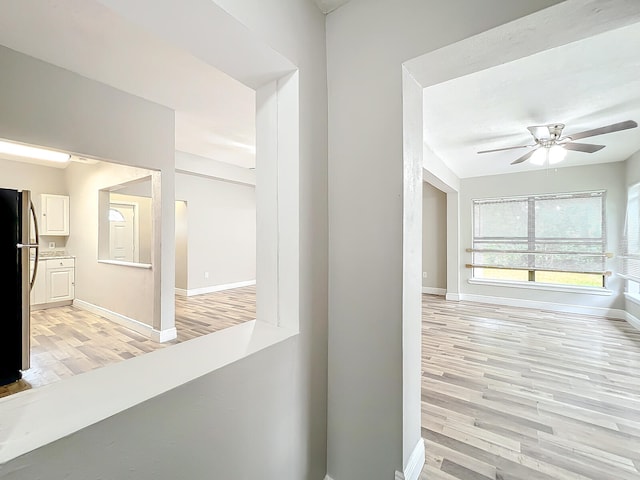 hall with light wood-type flooring