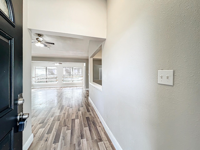 corridor featuring hardwood / wood-style flooring