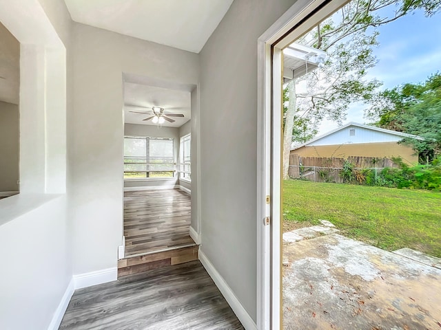 hall with dark hardwood / wood-style flooring