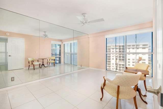 sitting room with tile patterned floors and plenty of natural light