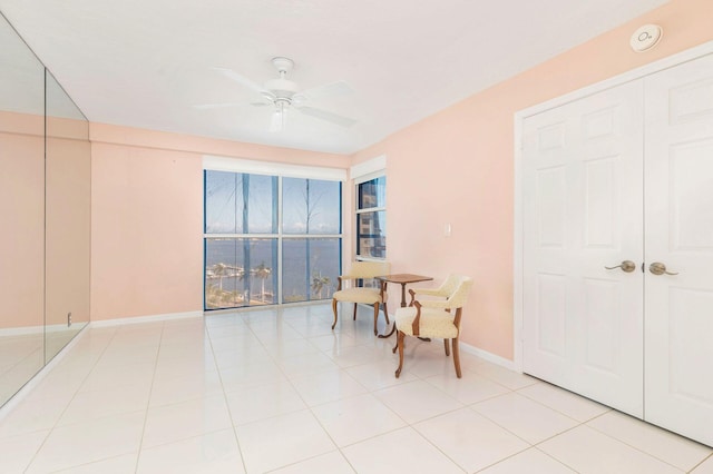 tiled dining room with ceiling fan