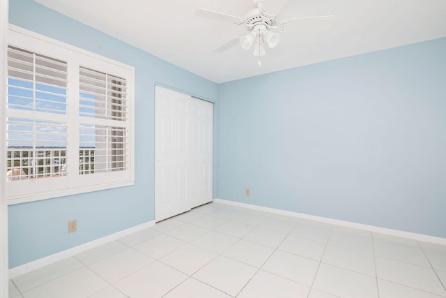 unfurnished bedroom featuring a closet and ceiling fan