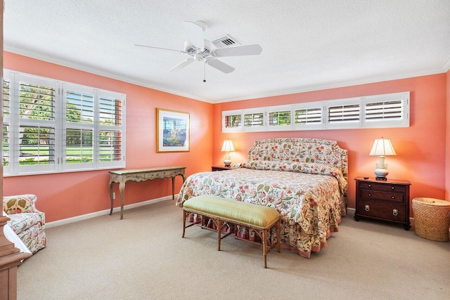 bedroom featuring a textured ceiling, carpet flooring, ceiling fan, and crown molding