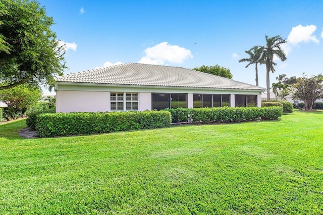 view of property exterior featuring a lawn