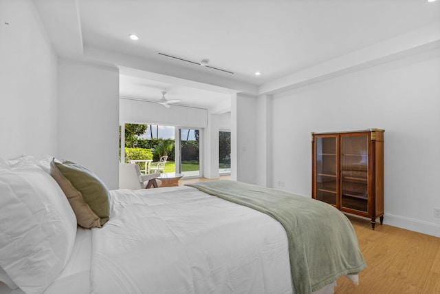 bedroom with light hardwood / wood-style floors and ceiling fan