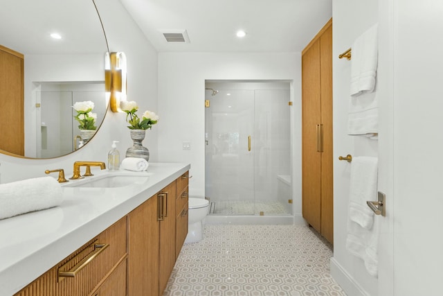 bathroom with toilet, recessed lighting, vanity, visible vents, and a stall shower