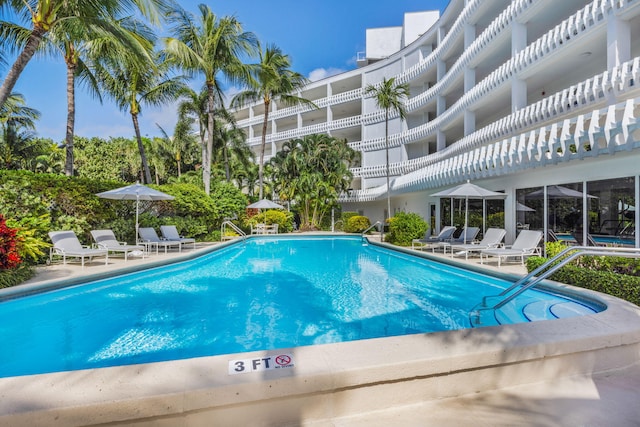 community pool with a patio area