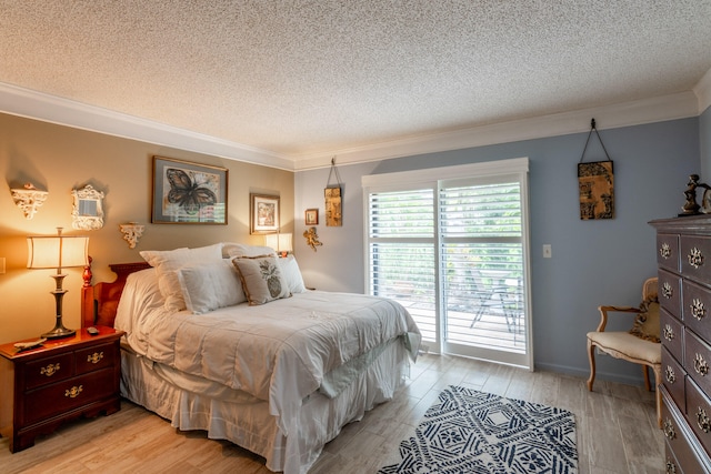 bedroom with access to exterior, a textured ceiling, light wood-type flooring, and ornamental molding