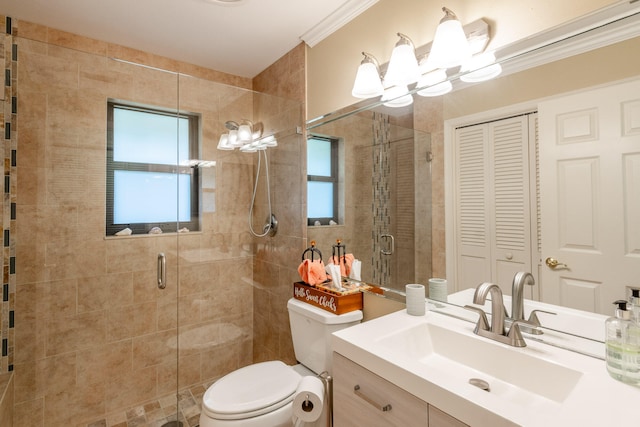 bathroom featuring a chandelier, vanity, toilet, and a shower with door