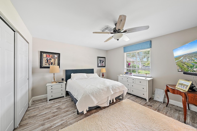 18352 Flagship Cir, Jupiter, FL 33458 - bedroom with a closet, light wood-style floors, and ceiling fan