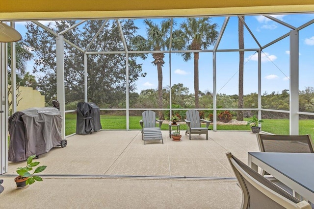 view of patio with a lanai and area for grilling