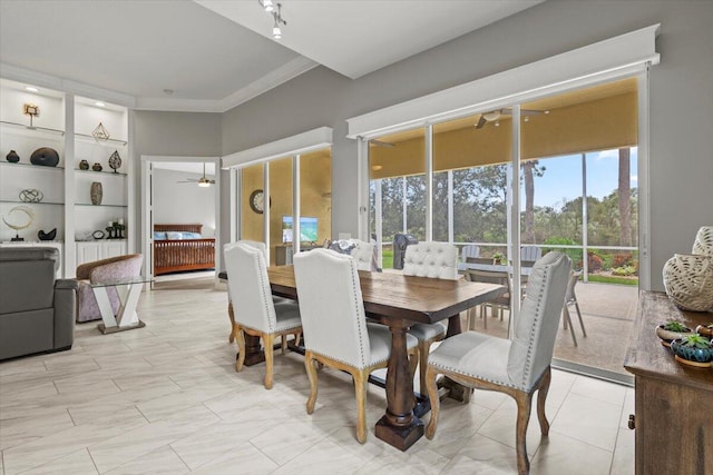 dining room featuring ceiling fan and crown molding