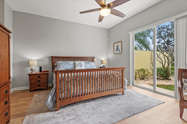 bedroom with light wood-type flooring, multiple windows, ceiling fan, and access to exterior