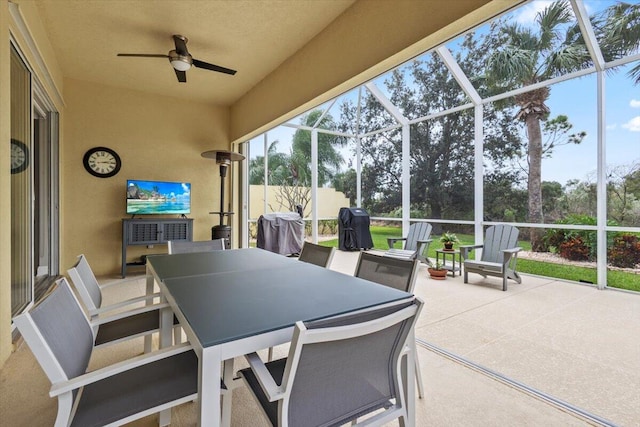 view of patio / terrace featuring a lanai and ceiling fan