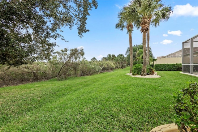 view of yard with a lanai