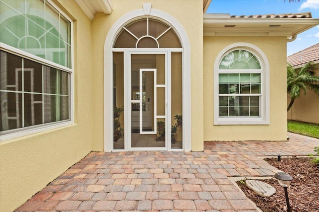 doorway to property with a patio area