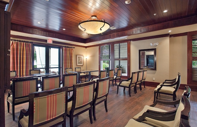 dining area with hardwood / wood-style flooring and wooden ceiling