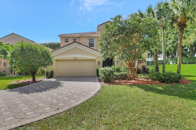 view of front of home with a garage and a front lawn