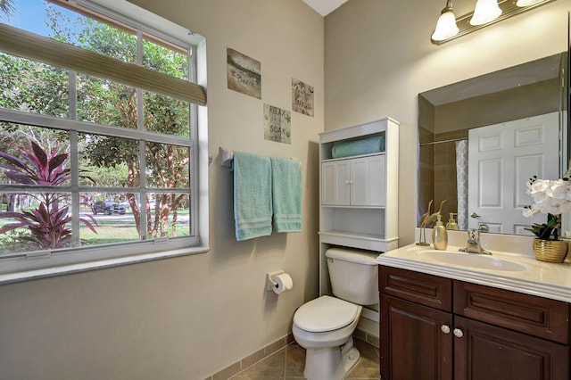 bathroom featuring walk in shower, toilet, vanity, and tile patterned floors