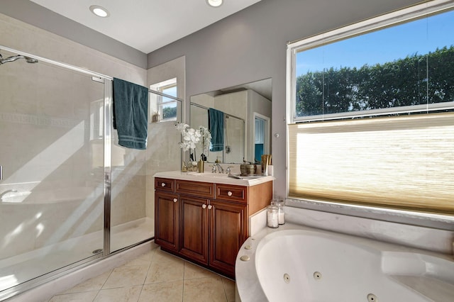 bathroom with vanity, tile patterned flooring, plenty of natural light, and shower with separate bathtub