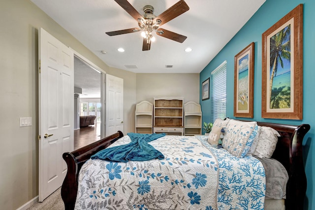 carpeted bedroom featuring ceiling fan