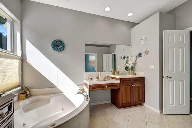 bathroom featuring a bathtub, vanity, and tile patterned floors