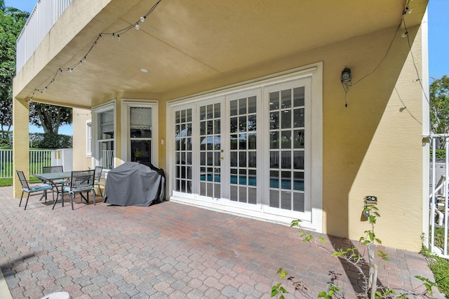 view of patio / terrace with french doors and a grill