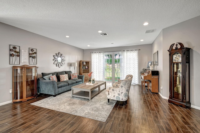 living room with french doors and a textured ceiling