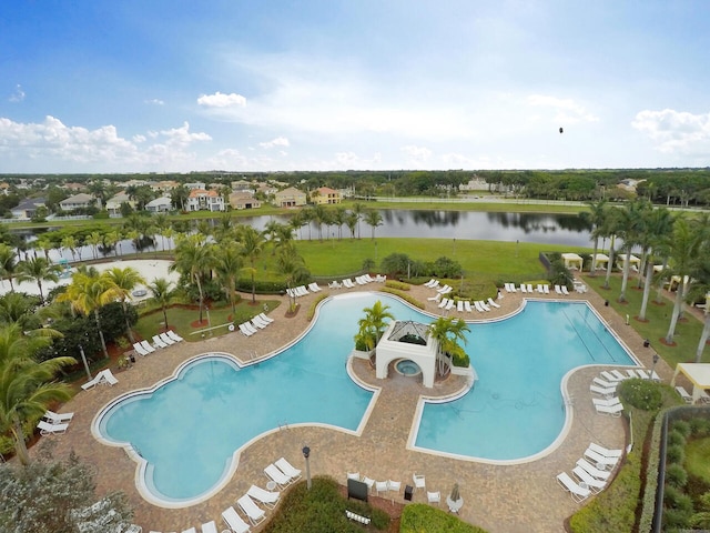 view of pool featuring a patio and a water view