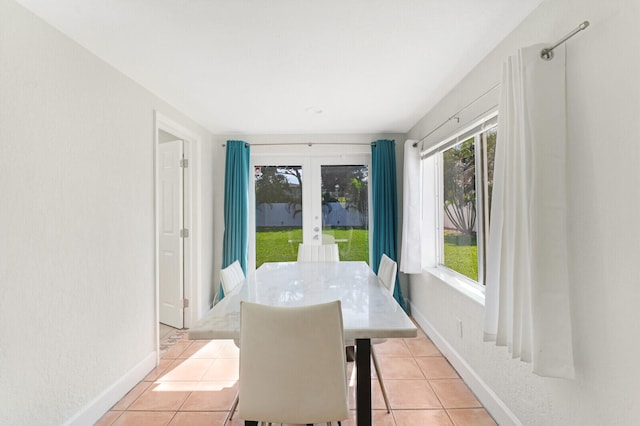 tiled dining room with french doors