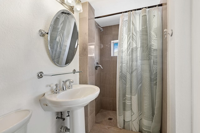 bathroom with toilet and walk in shower