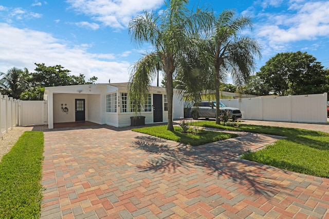 rear view of property with a yard