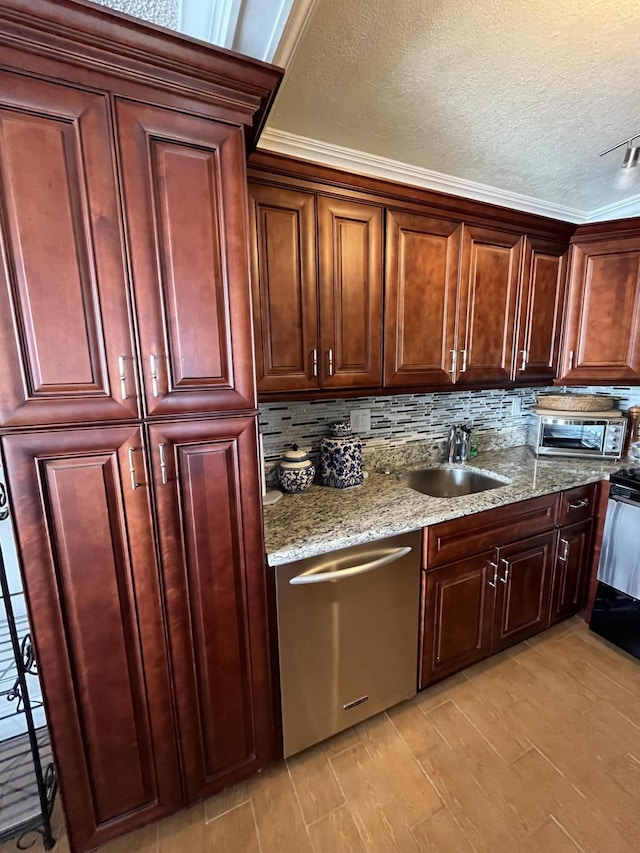 kitchen with stove, a sink, backsplash, light stone countertops, and dishwasher