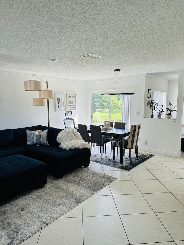 living room with light tile patterned floors and a textured ceiling