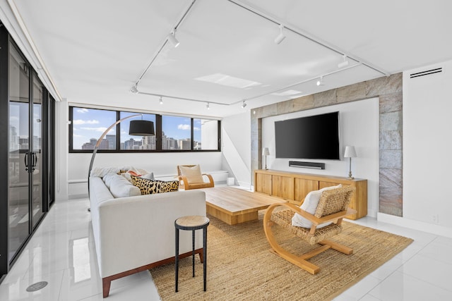 living room featuring light tile patterned flooring and track lighting