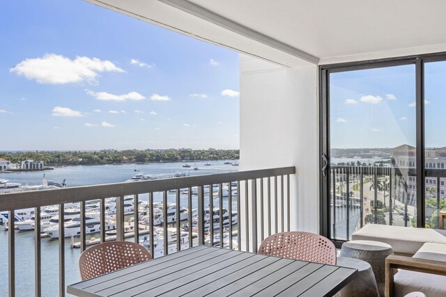 balcony featuring a water view