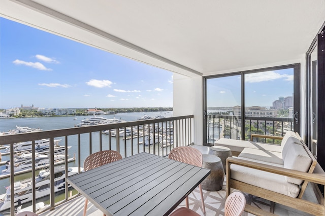 balcony featuring a water view