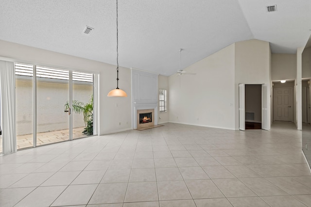 unfurnished living room with high vaulted ceiling, ceiling fan, and light tile patterned floors