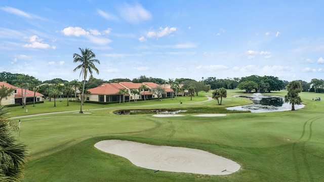 surrounding community featuring a water view and a yard