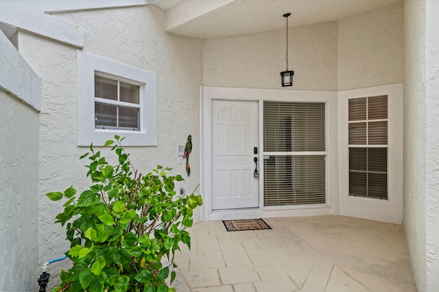 property entrance with a patio