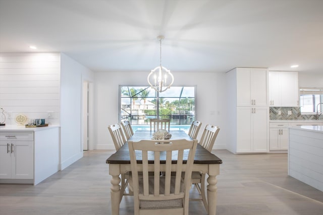 dining room featuring a chandelier and light hardwood / wood-style flooring