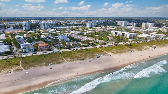 aerial view featuring a view of the beach and a water view