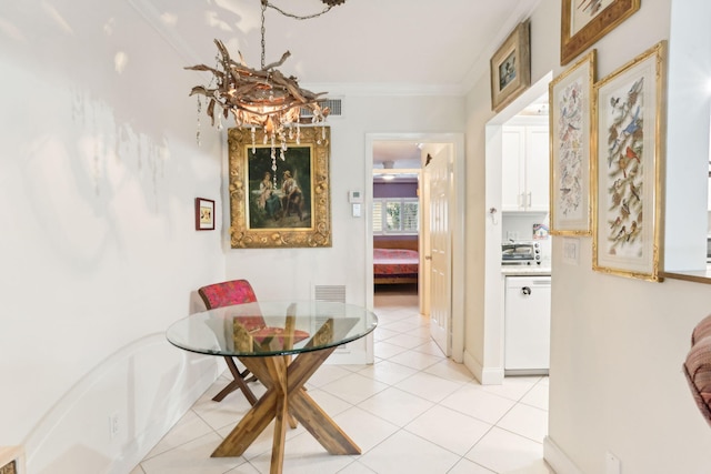 hallway featuring light tile patterned floors and ornamental molding